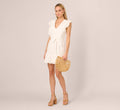 Sleeveless Ruffle Eyelet Mini Dress In Ivory